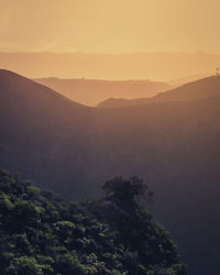 Scenic view of mountains against sky during sunset