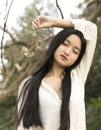 Chinese teenager with a flower in hand ii