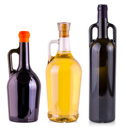 Close-up of beer bottles against white background