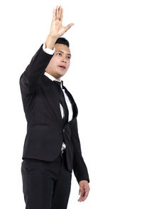 Mid adult woman standing against white background