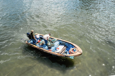 High angle view of people in boat at sea