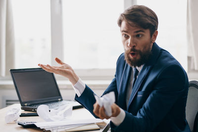 Side view of businessman working at office