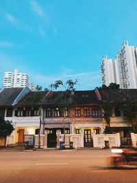 Residential buildings against blue sky