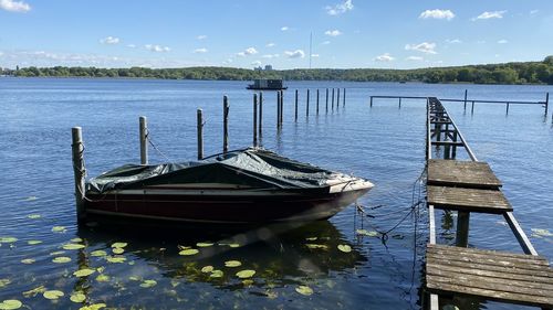 Pier over lake against sky