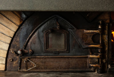 Antique wood oven with cast iron door.