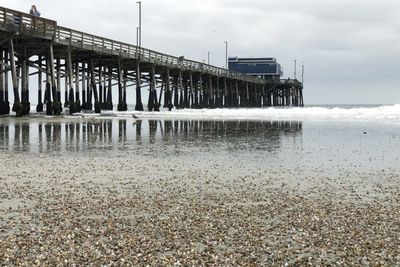 Pier over sea against sky