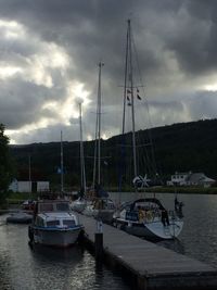 Boats moored at harbor