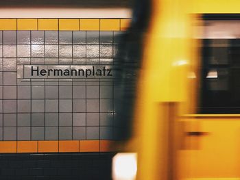 Blurred motion of yellow train at subway station