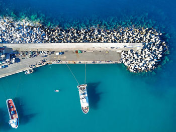 High angle view of boats in sea, and a little port