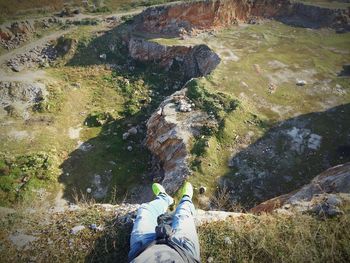 Low section of person standing on rocks