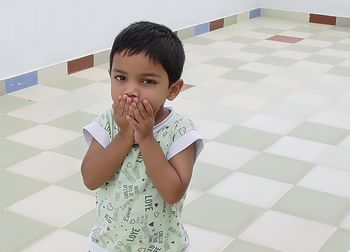 Portrait of cute boy at home