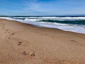 Scenic view of beach against sky