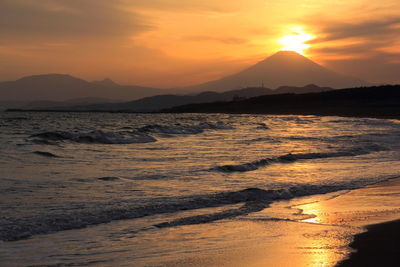 Scenic view of sea at sunset