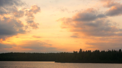 Scenic view of silhouette trees against sky during sunset