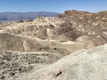 Scenic view of arid landscape against sky