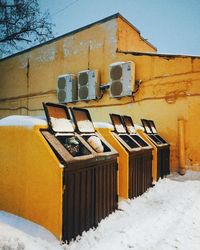 Built structure in winter against sky