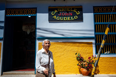 Senior woman tourist at the beautiful heritage town of jerico located in colombia.