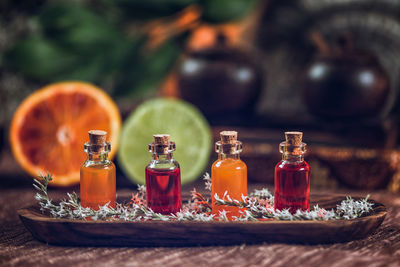 Close-up of essential oils in bottles on table