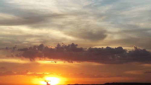 Low angle view of dramatic sky during sunset