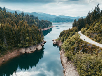 Scenic view of lake and mountains against sky