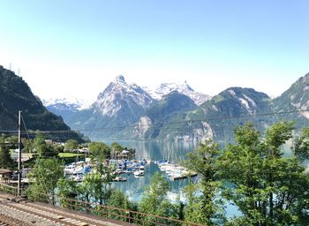 Scenic view of lake and mountains against clear sky