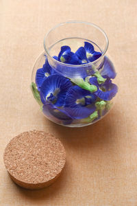 High angle view of purple flowers in bowl on table