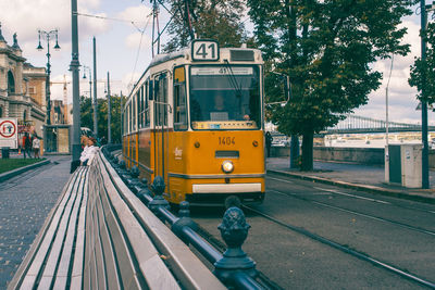 Tram in city against sky