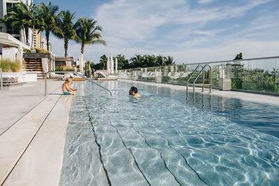 Father and son in swimming pool