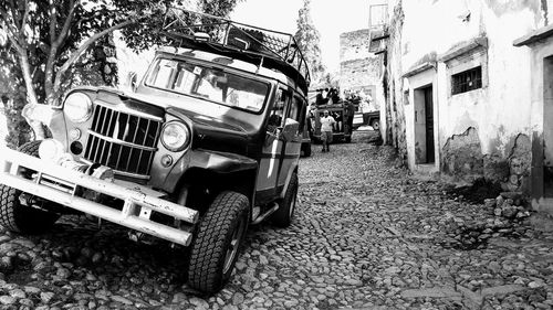 Old car on street in city