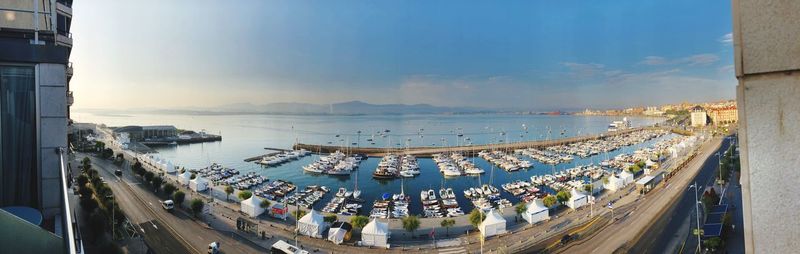 High angle view of boats in sea against sky