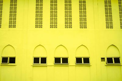 Full frame shot of yellow windows on wall