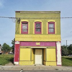 Exterior of yellow building against sky