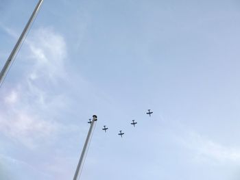 Low angle view of airplane flying in sky