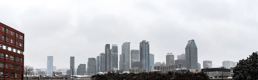 Modern buildings in city against sky