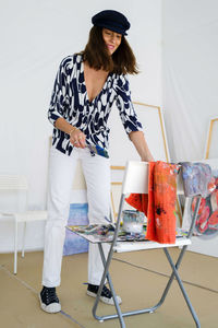 Young female artist in her painting studio