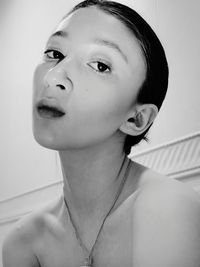 Portrait of shirtless boy looking away