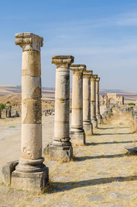 Old pillars at roman ruins of volubilis, morocco, north africa