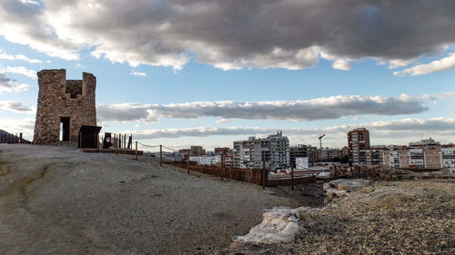 Panoramic view of beach and buildings against sky