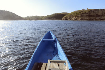 Blue boat floating in sea