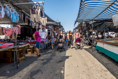 People on street market in city