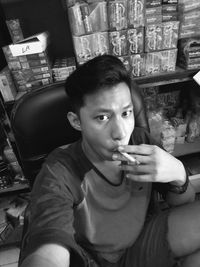 Portrait of man sitting at home