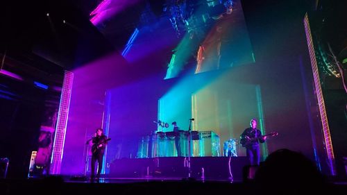 Panoramic view of illuminated stage at concert