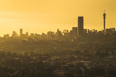 Buildings in city against sky