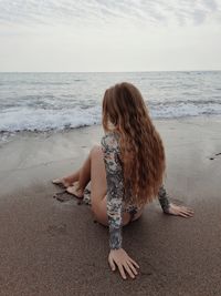 Woman sitting on beach