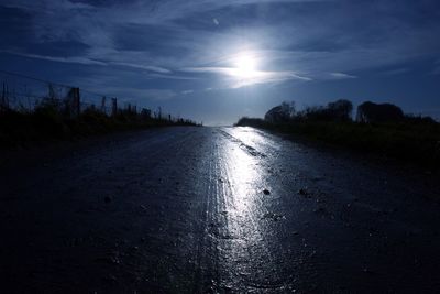 Road amidst landscape against sky