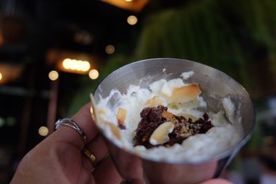 Midsection of person holding ice cream