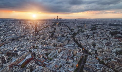 Aerial view of cityscape during sunset