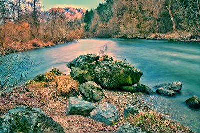 Scenic view of lake and mountains against sky