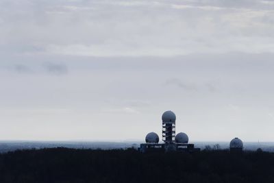 Scenic view of water tower against sky