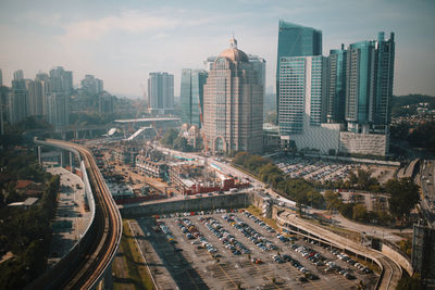 High angle view of modern buildings in city against sky